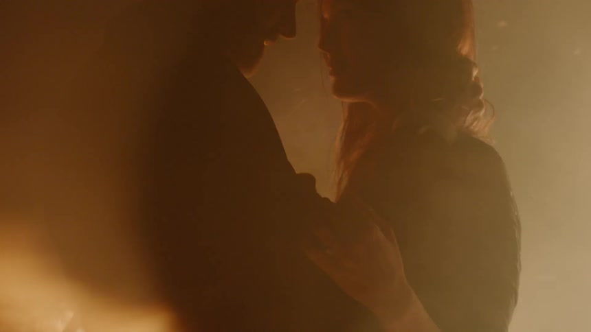 Couple Kissing By Fire In Desert