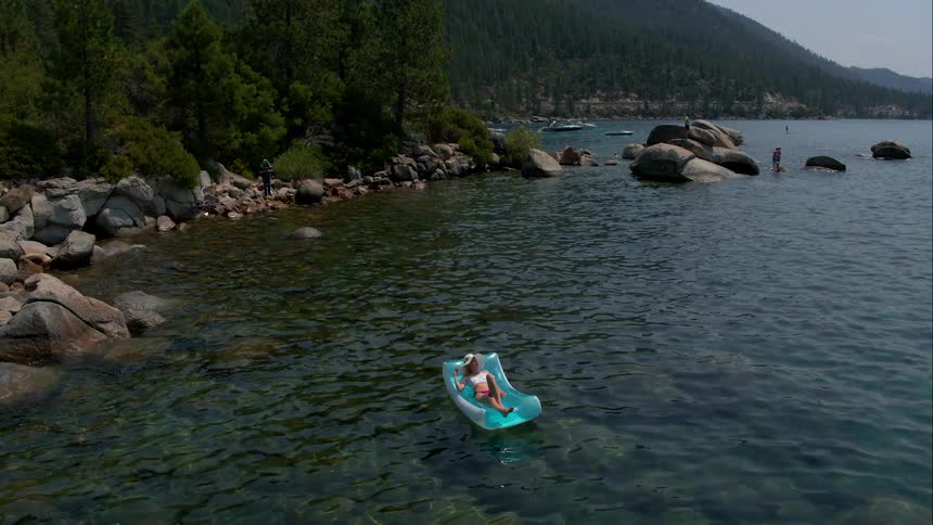 A woman is floating in the water