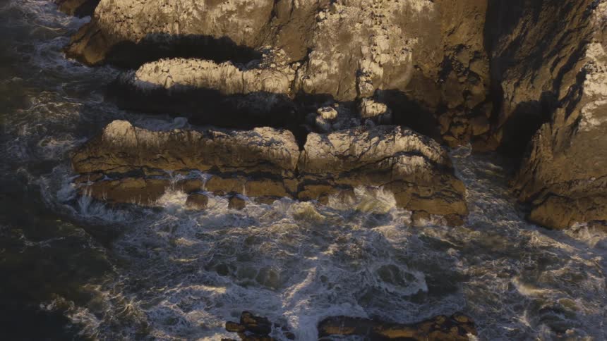 Waves crashing into rocks along the coast