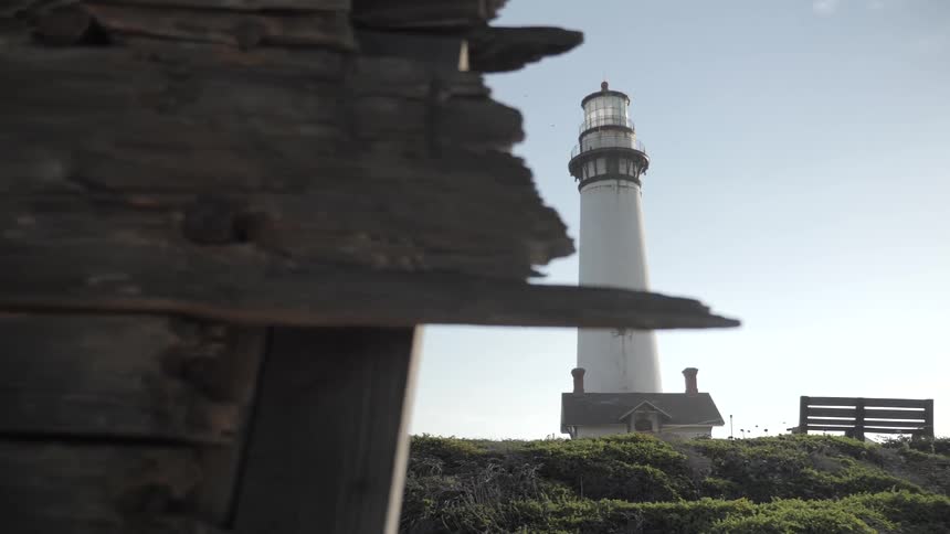 A lighthouse is high in the sky