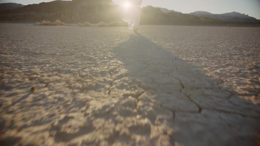 A woman is walking in a rural area