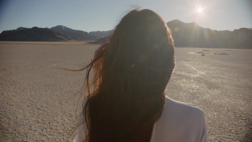 A woman is standing outside