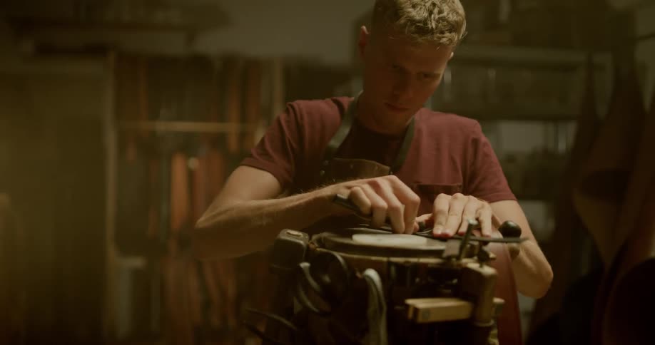 A man is cutting an object into little pieces
