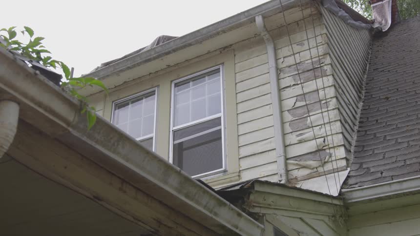 Old worn out house with peeling paint