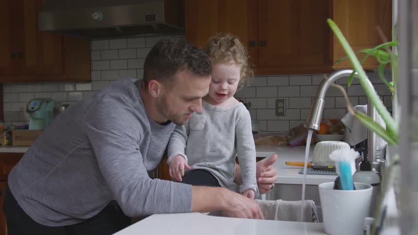 Father And Daughter Playing At Home