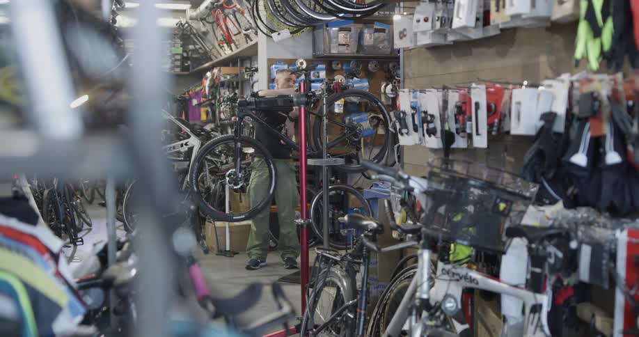 A man working in a bicycle shop