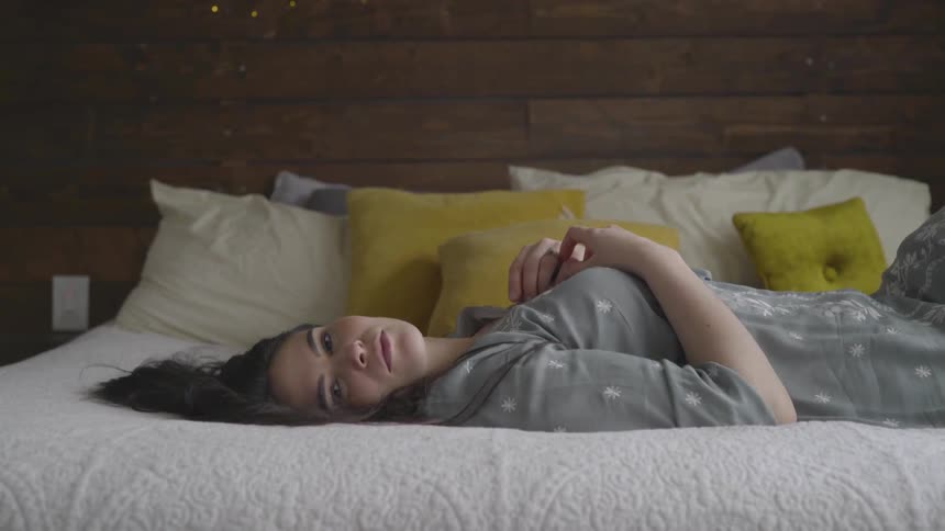 A woman lying on a bed