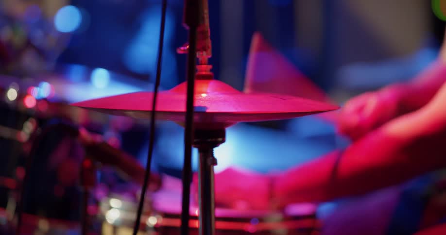 Musician playing drums on a stage