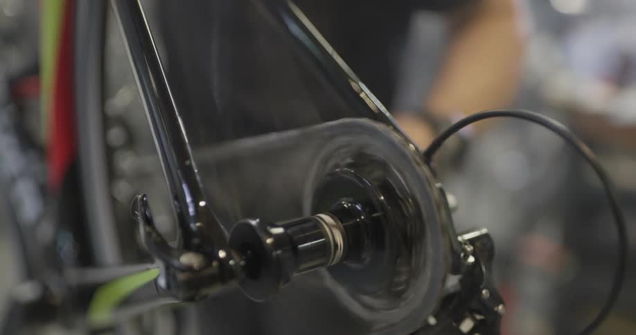 Person works on bicycle chain