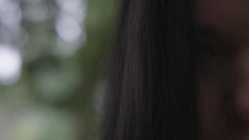 Closeup of a woman's eye and nose