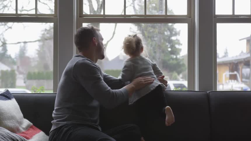 Father And Daughter Playing At Home