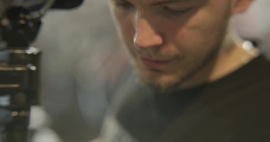 A bicycle shop employee works in the shop
