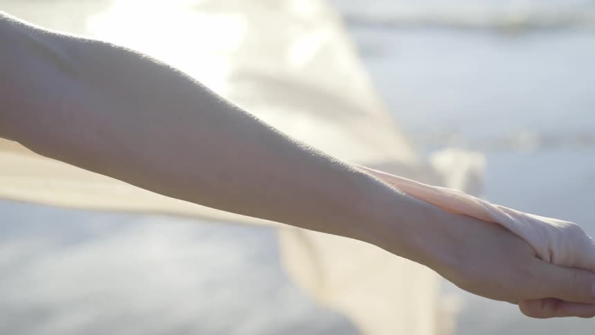 A woman letting a dress blow in the wind
