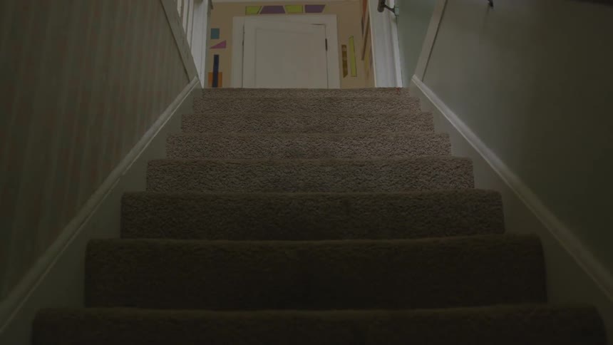 A person walking up a flight of stairs