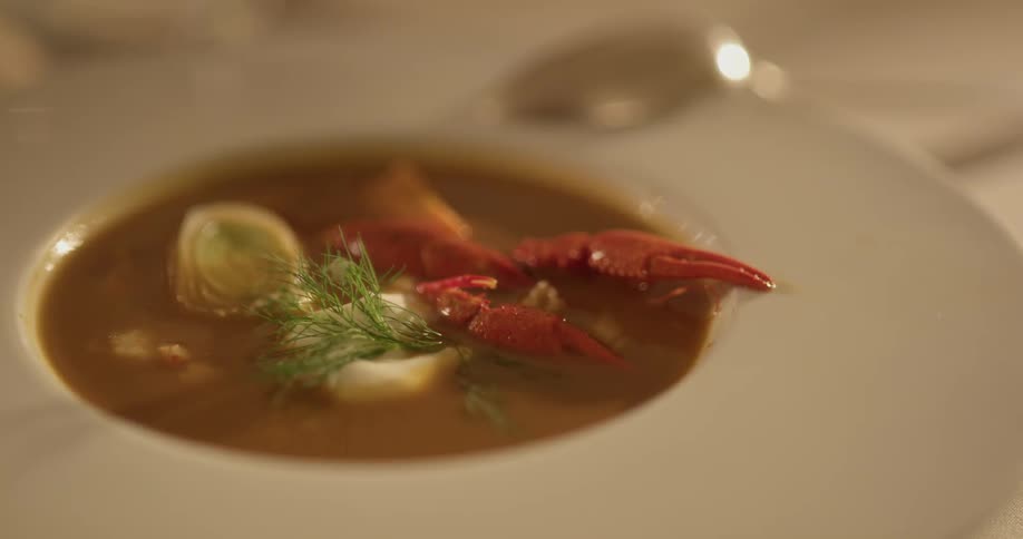 Bowl of soup in a well lit room