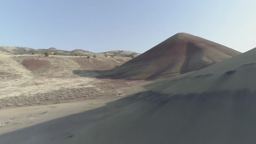 A canyon that has striped colored mountains