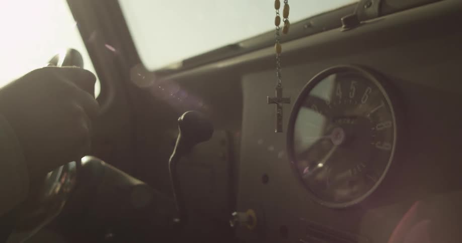 Close up of a steering wheel and odometer