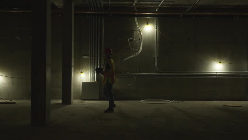 A person is walking in the dark