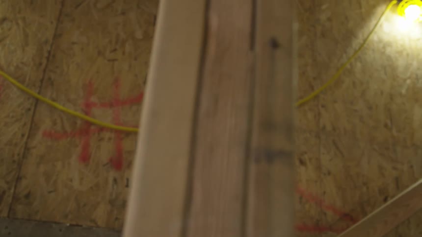 Construction worker goes upstairs