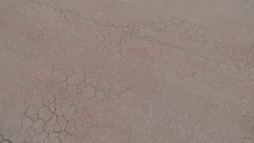 Cracked desert lays below