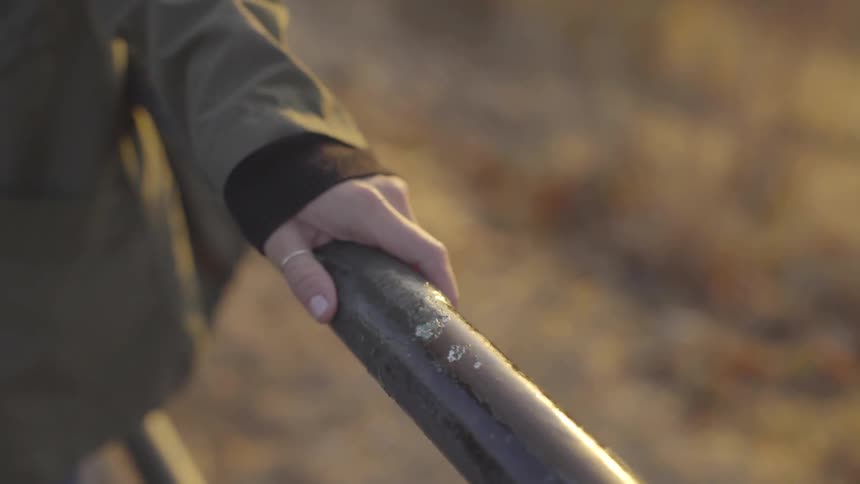 A woman hold on to a railing