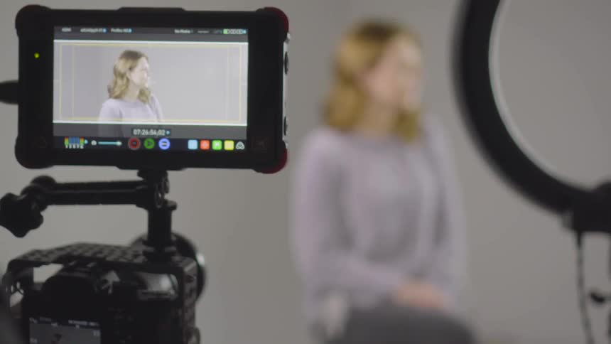 A woman sitting in a photography studio