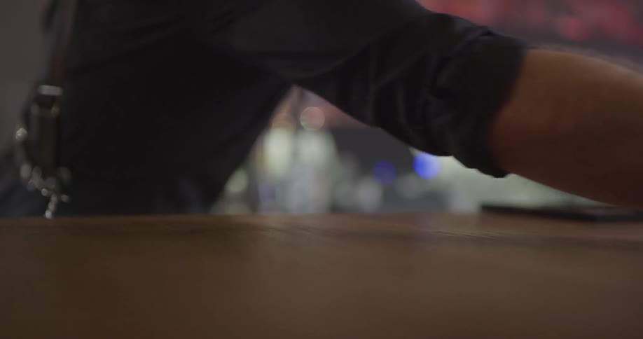 Bartender wipes the counter