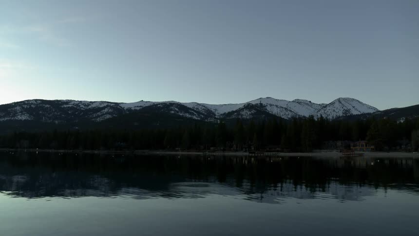 Water flows freely in front of the mountains