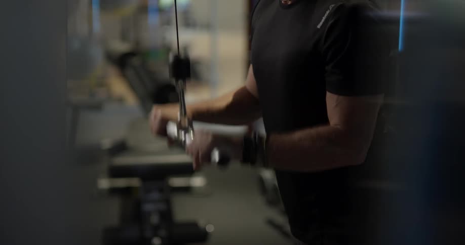 Elderly man exercises in a gym