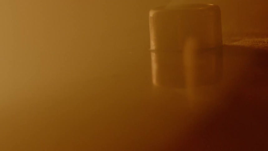 A fire glowing and a cylinder like object