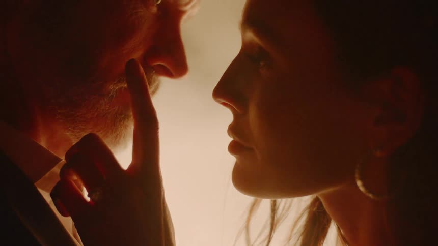 A man and woman look into each other eyes