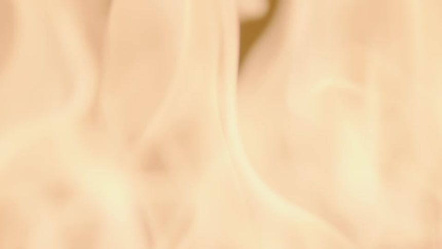 A fire starting and growing across a surface