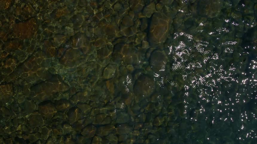There are rocks beneath the water