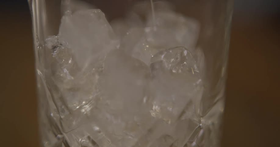 Liquid is being poured into a glass