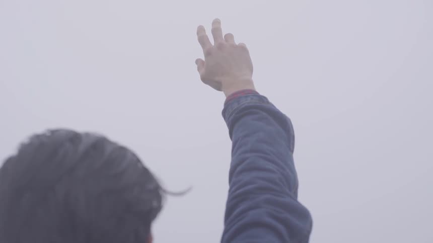 Friends Hiking In Foggy Forest
