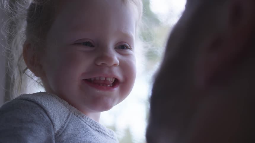 Dad making his daughter laugh