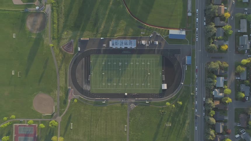 Football field among green lawn