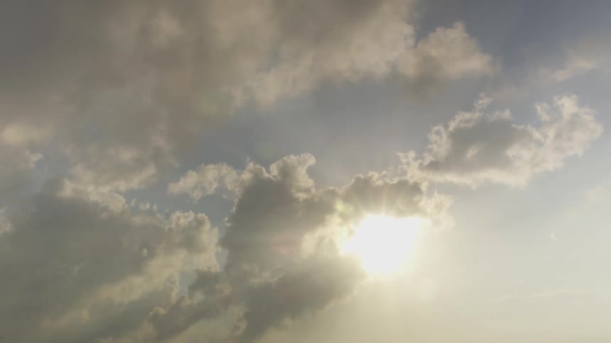 Clouds moving across the sun