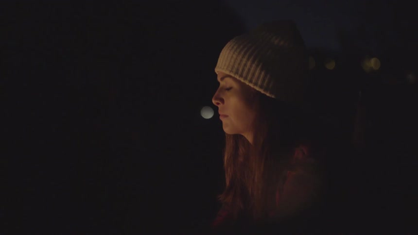 People sitting around a campfire