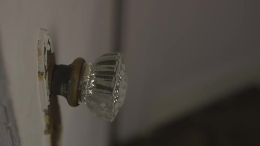 A door knob is turning