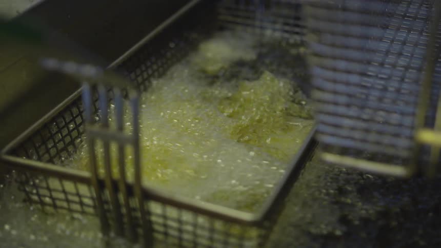 Fries frying in a fryer