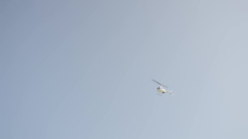 Helicopter Flying Over Ocean