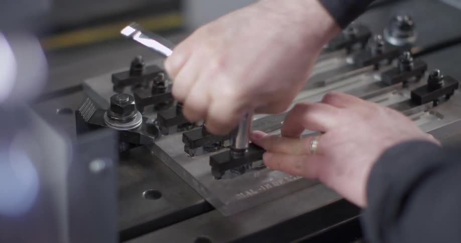A person using a socket wrench