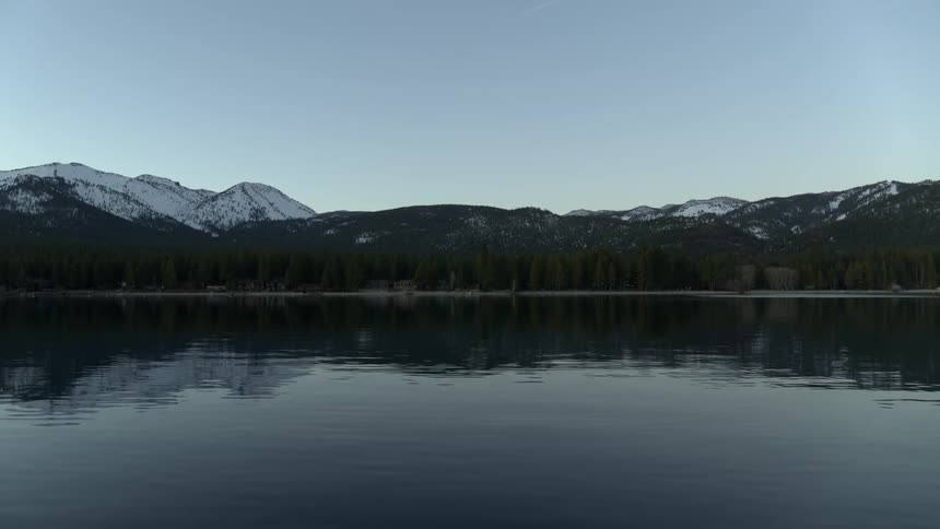 A lake at the base of a mountain range