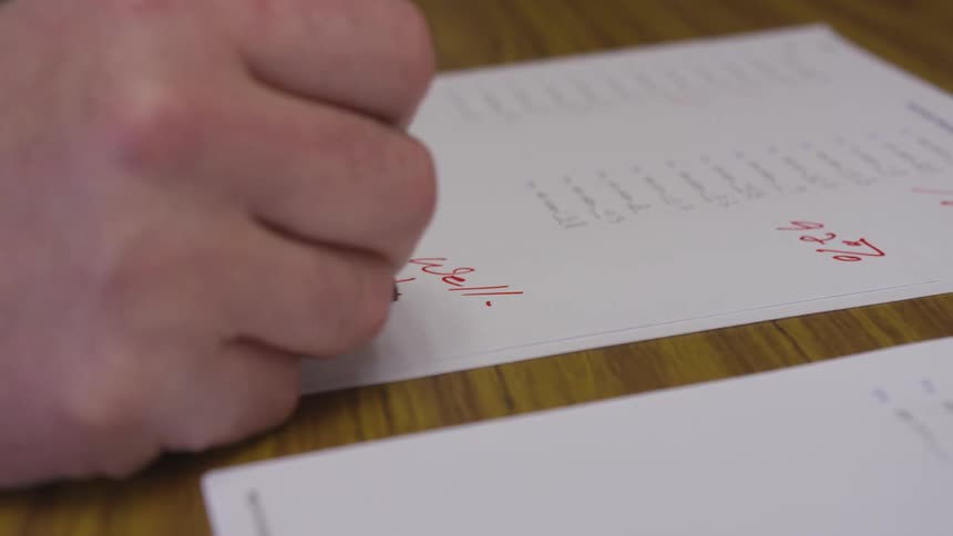 Someone grading a paper