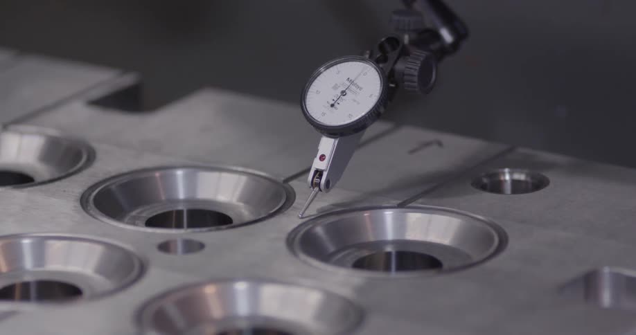 An electronic device with a needle on an arm tracks around metal circles
