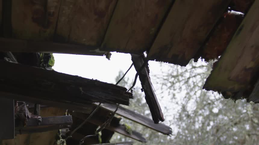Hooded Figure In Abandoned House