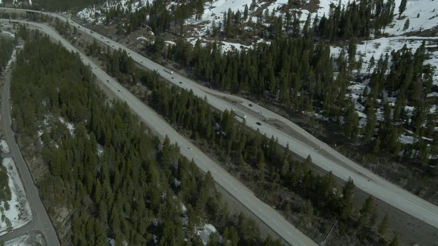 Cars travel along the mountain road