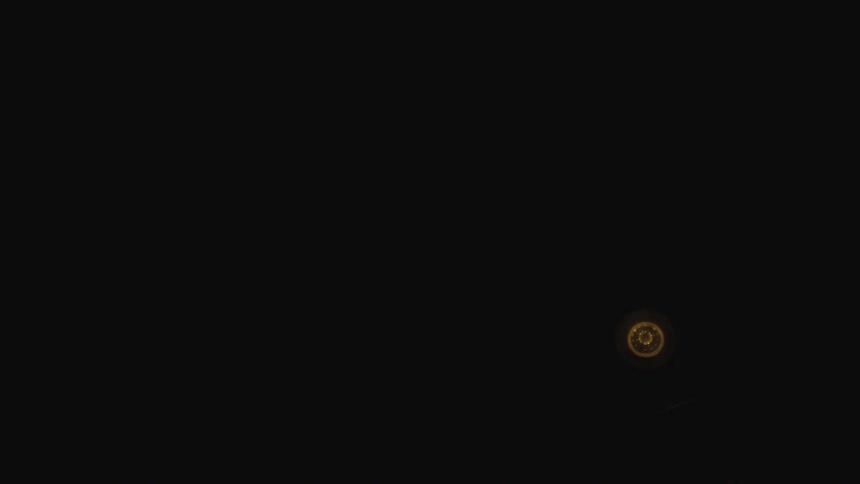 A light bulb is turned off and the room darkens
