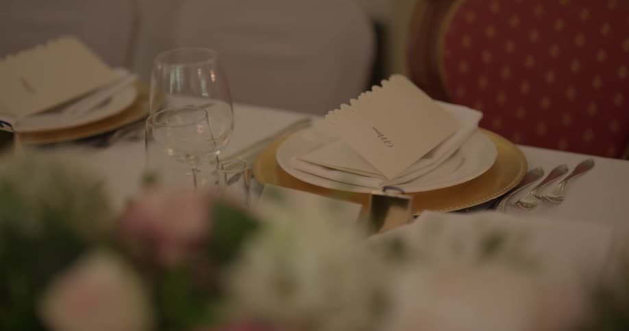 There are cups, plates, and utensils on a table